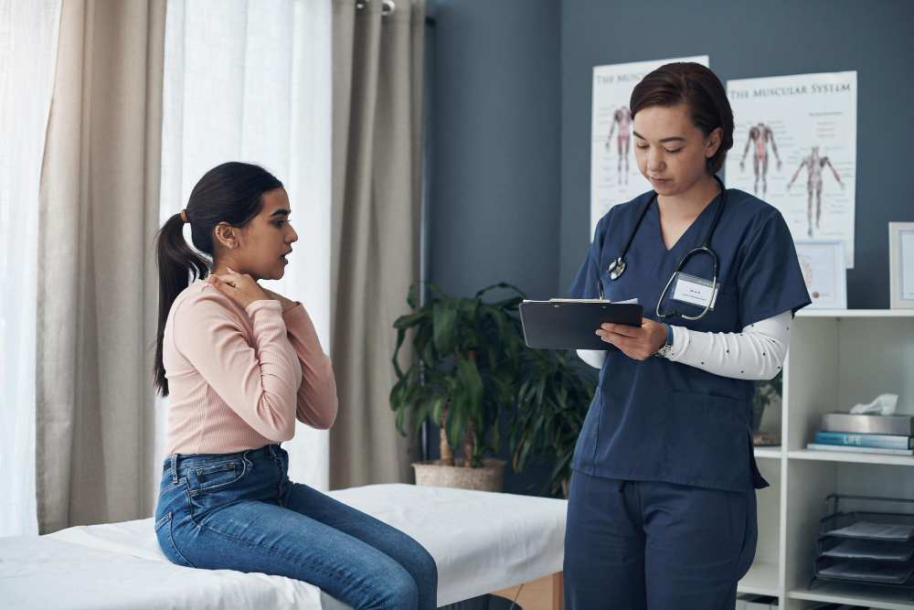 A gynae doctor checking a woman in a woman's clinic.